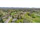 Aerial shot of a golf course community, surrounded by mature trees at 21 Fairway Ln, Littleton, CO 80123