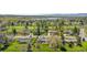 Scenic aerial view of homes in a neighborhood with golf course and lake views at 21 Fairway Ln, Littleton, CO 80123
