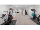 Spacious basement with gym equipment, fireplace, and carpet throughout the open space at 21 Fairway Ln, Littleton, CO 80123