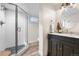 Modern bathroom boasts a sleek glass shower and stylish vanity at 21 Fairway Ln, Littleton, CO 80123