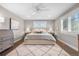 Serene primary bedroom featuring a plush rug, a ceiling fan, and plenty of natural light at 21 Fairway Ln, Littleton, CO 80123