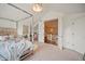 Bedroom features a canopy bed and desk area, along with an open view to the upstairs landing at 980 E Tufts Ave, Cherry Hills Village, CO 80113