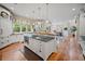 Bright and spacious kitchen island features a modern design, sink, and wooden countertops at 980 E Tufts Ave, Cherry Hills Village, CO 80113