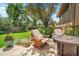 Cozy backyard patio with outdoor seating, fire pit, and serene landscaping at 11496 E Wesley Ave, Aurora, CO 80014