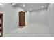 Unfinished basement area with a safe, storage, and ample open space at 11496 E Wesley Ave, Aurora, CO 80014