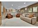 Comfortable basement with neutral tones, plush seating, and natural light at 11496 E Wesley Ave, Aurora, CO 80014