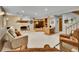 Spacious basement with brick fireplace and built-in wooden shelving at 11496 E Wesley Ave, Aurora, CO 80014
