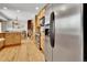 Spacious kitchen with hardwood floors, stainless steel appliances and view of the breakfast nook at 11496 E Wesley Ave, Aurora, CO 80014