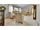 Bright living room features large windows, neutral carpeting and vaulted ceilings at 11496 E Wesley Ave, Aurora, CO 80014