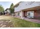 Patio and backyard area showcasing outdoor seating and well-maintained greenery at 2552 E Alameda Ave # 47, Denver, CO 80209