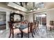 Formal dining room with an elegant glass table, and stylish wall decor at 2552 E Alameda Ave # 47, Denver, CO 80209