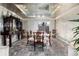 Elegant dining room with a glass-top table, stylish chairs, and a decorative ceiling at 2552 E Alameda Ave # 47, Denver, CO 80209