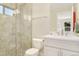 This bathroom includes a glass shower and vanity with plenty of counter space at 3720 Jason St, Denver, CO 80211