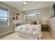 Bright bedroom includes a spacious closet, bookshelf and two large windows at 3720 Jason St, Denver, CO 80211