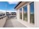 Wide deck with gray flooring, modern railings, and several large windows for plenty of light at 3720 Jason St, Denver, CO 80211