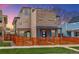 Modern two story home features a brick facade, a quaint front yard, and a wooden fence for added privacy at 3720 Jason St, Denver, CO 80211