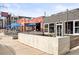 Restaurant's outdoor patio features blue umbrellas and string lights, creating a relaxed atmosphere at 3720 Jason St, Denver, CO 80211