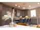 Stylish kitchen featuring modern cabinetry, sleek countertops, and a breakfast bar perfect for casual dining at 3720 Jason St, Denver, CO 80211