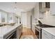 Well-appointed kitchen with a large island, stainless steel appliances, ample counter space, and plenty of storage at 3720 Jason St, Denver, CO 80211