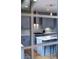 Features of a modern kitchen with gray cabinets, stainless steel appliances and a central island at 3720 Jason St, Denver, CO 80211
