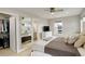 This main bedroom boasts a ceiling fan, walk-in closet, and ensuite bathroom for ultimate comfort at 3720 Jason St, Denver, CO 80211