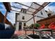 Charming backyard patio area with comfortable seating, pergola, and stylish decor perfect for enjoying the outdoors at 3720 Jason St, Denver, CO 80211