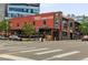 Exterior view of a local restaurant, The Post Chicken & Beer, at an intersection with pedestrian crosswalk at 3720 Jason St, Denver, CO 80211