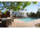 Backyard oasis featuring a sparkling pool, outdoor seating, and lush landscaping for relaxation at 1996 Clipper Dr, Lafayette, CO 80026