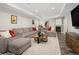 Cozy finished basement with a fireplace, entertainment area, and a large sectional sofa for comfortable living at 1996 Clipper Dr, Lafayette, CO 80026