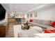 Spacious finished basement featuring a large sectional, entertainment area, and stylish bar for hosting guests at 1996 Clipper Dr, Lafayette, CO 80026