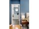 View from bedroom to bathroom with blue walls and modern design at 1996 Clipper Dr, Lafayette, CO 80026