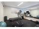 Home gym with exercise equipment, a mirror wall, and rubber flooring, for a convenient workout space at 1996 Clipper Dr, Lafayette, CO 80026