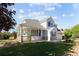 Inviting home showcasing a covered porch, beautiful landscaping, and classic architectural details at 1996 Clipper Dr, Lafayette, CO 80026