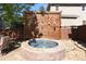 A beautiful stone hot tub with privacy screen and stone base at 1996 Clipper Dr, Lafayette, CO 80026
