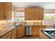 Stylish kitchen showcasing granite countertops, custom cabinetry, and stainless steel appliances at 1996 Clipper Dr, Lafayette, CO 80026