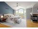 Bright, spacious main bedroom with fireplace and sitting area at 1996 Clipper Dr, Lafayette, CO 80026