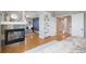 Bright main bedroom with fireplace, built-in shelving and seating area at 1996 Clipper Dr, Lafayette, CO 80026