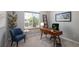 Inviting home office space featuring a stylish desk, comfortable seating, and a large window with natural light at 1996 Clipper Dr, Lafayette, CO 80026