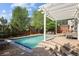 Backyard pool with patio area and outdoor seating at 1996 Clipper Dr, Lafayette, CO 80026