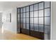 Unique glass panel barn door with black trim at 1738 N Franklin St # 2B, Denver, CO 80218