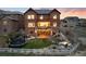 Backyard showcasing outdoor seating, hot tub, lush lawn, trampoline and a fire pit for relaxing evenings at 10580 Greycliffe Dr, Highlands Ranch, CO 80126