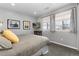 Bright bedroom with neutral colors, modern decor, and large windows for natural light at 10580 Greycliffe Dr, Highlands Ranch, CO 80126