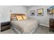 Bedroom featuring a stylish wooden headboard, complemented by ambient lighting and tasteful decor, creates a cozy and inviting space at 10580 Greycliffe Dr, Highlands Ranch, CO 80126