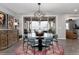 Dining room featuring a round wood table, six blue chairs and outdoor views at 10580 Greycliffe Dr, Highlands Ranch, CO 80126