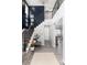 Elegant foyer with staircase, stylish decor, and wood-look floors that create a warm and welcoming entrance at 10580 Greycliffe Dr, Highlands Ranch, CO 80126