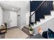 Inviting foyer with staircase featuring stylish decor and ample natural light at 10580 Greycliffe Dr, Highlands Ranch, CO 80126