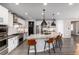 Modern kitchen with a large center island and seating, ideal for entertaining and casual dining at 10580 Greycliffe Dr, Highlands Ranch, CO 80126