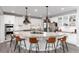 Bright kitchen with a large center island and seating, ideal for entertaining and casual dining at 10580 Greycliffe Dr, Highlands Ranch, CO 80126