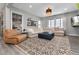 Living room showcasing a large sectional sofa, rug and oversized windows at 10580 Greycliffe Dr, Highlands Ranch, CO 80126