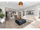 Open concept living room showcasing modern finishes, view of the kitchen, and stylish decor at 10580 Greycliffe Dr, Highlands Ranch, CO 80126